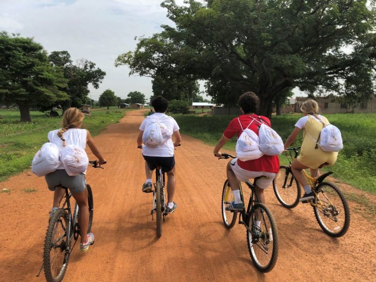 Volunteers riding bikes